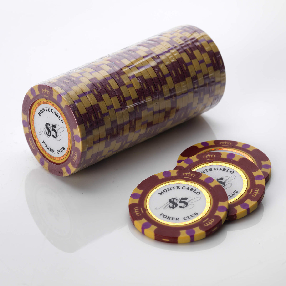 Wrapped roll of burgundy and gold Monte Carlo poker chips with three loose chips in front of it
