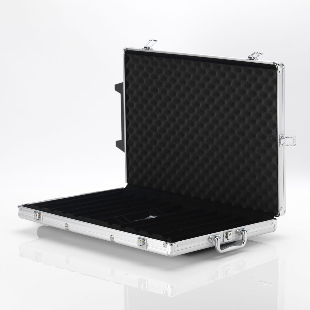 Open empty silver aluminium poker chip case with black foam lining