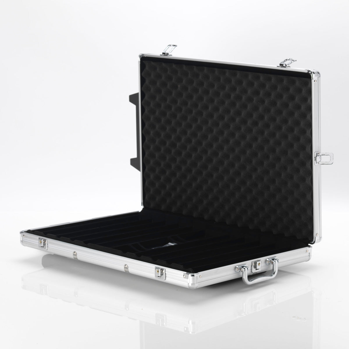 Open empty silver aluminium poker chip case with black foam lining