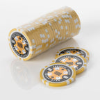 Stack of yellow and white Squirrel Poker Club poker chips with three loose chips in front of it