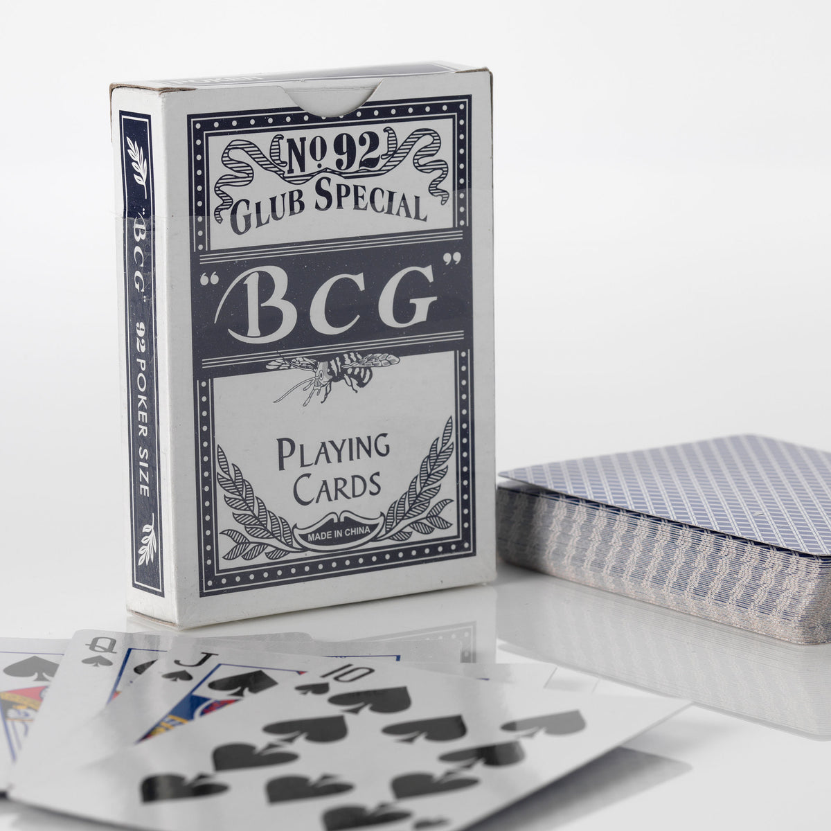 BCG Club Special blue playing card box with a deck of cards fanned out beside it