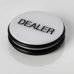Large white 3 inch poker dealer button with DEALER printed in black lettering