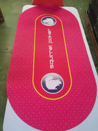 Full view of the red oval poker table mat with yellow betting lines and Squirrel Poker logos