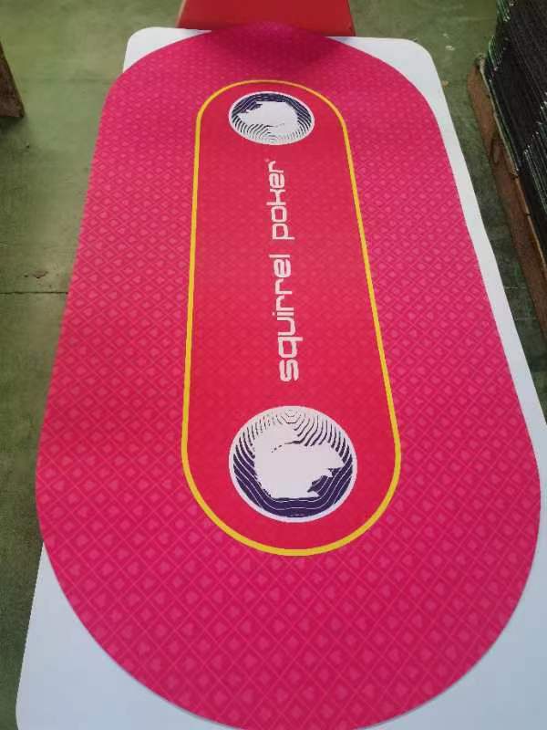 Full view of the red oval poker table mat with yellow betting lines and Squirrel Poker logos