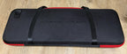 Closed black EVA poker chip case with red trim and two carry straps, seen from above