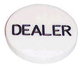 White round poker dealer button with the word DEALER printed in black
