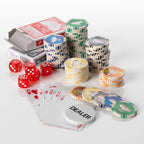Las Vegas poker set with stacks of casino chips, red dice, playing cards and a white dealer button on a white background