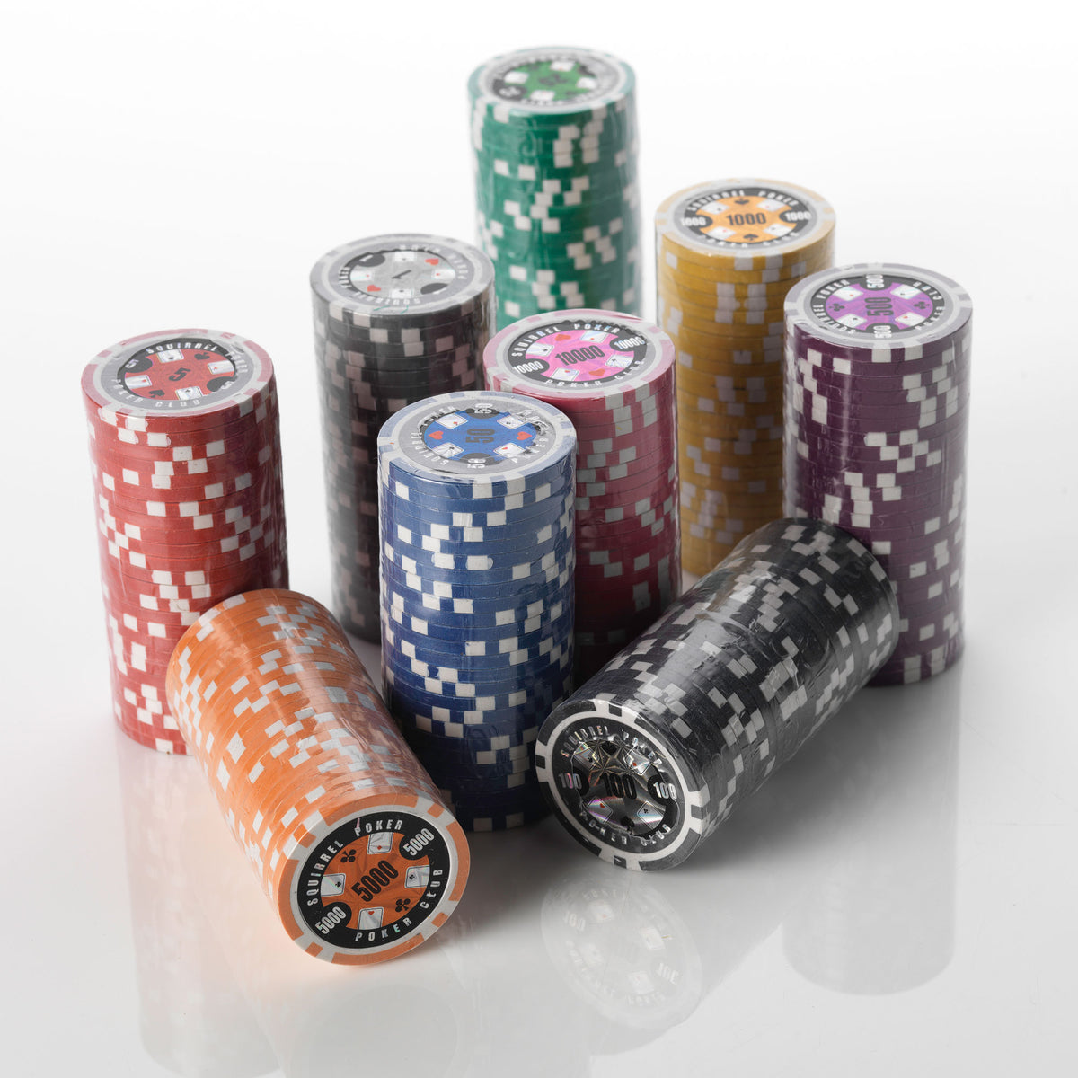 Stacks of Poker Club clay poker chips in multiple colours