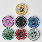 Seven Ultimate poker chips in pink, black, blue, green, red, yellow and grey, arranged in a pyramid on a white background